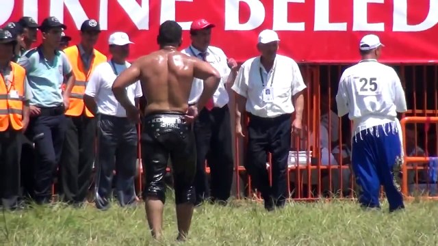 Muscular Turkish Men Oil Wrestling