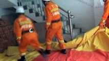 Amazing footage: Suicide jumper in China caught in mid-air by firefighters