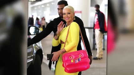 Amber Rose In Candy Colours With Inflatable Moschino Bag