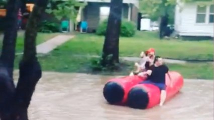 Floating through flooded Kansas streets