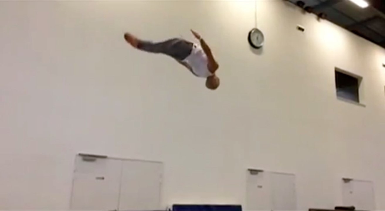 Acrobat Practices Flips in an Inspiring Workout