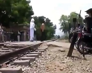 Crazy indian old man tries a Breathtaking Stunt at Railway