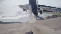 AMAZING a plane skims the heads of fishermen