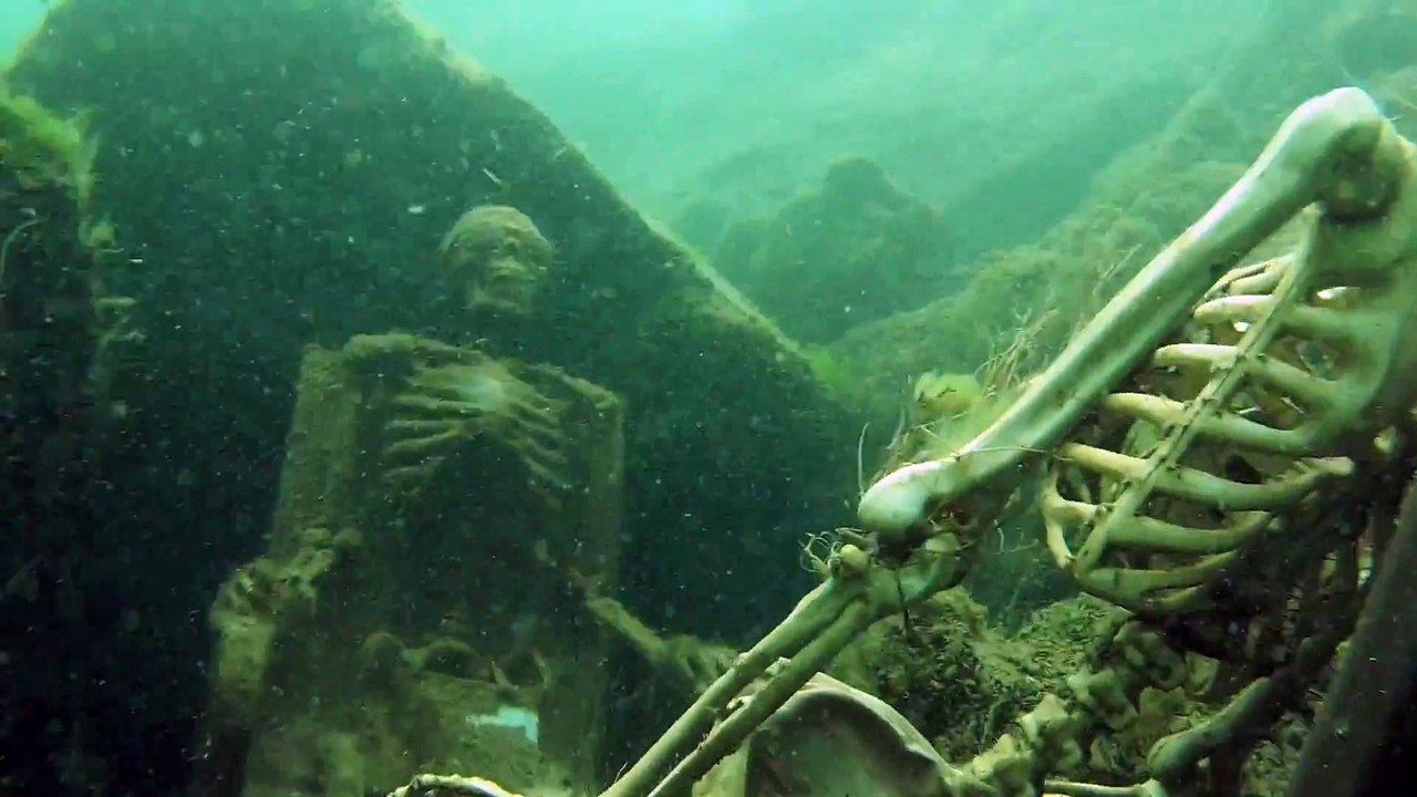 Skeleton Tea Party : human remains found under water sat on chairs drinking tea....