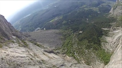 Fearless BASE jumper flies over Dolomites Alps