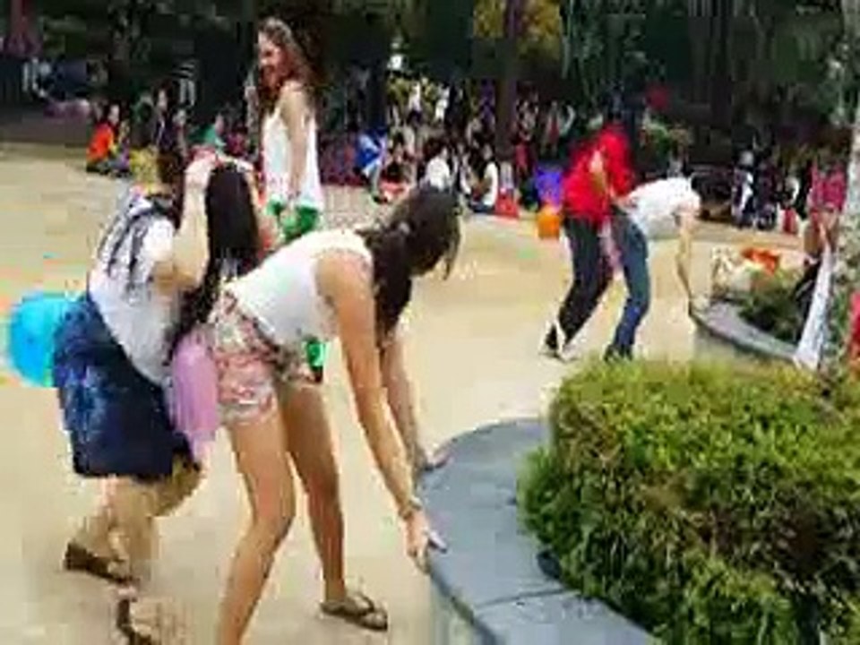 Hot girls playing ass to ass game on public with baloons.