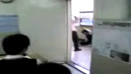 Korean teacher beats student with bamboo sword.