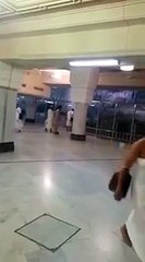 A Man Breaking The Glass Wall Which Is Surrounding The Safa Mountain In Makkah -