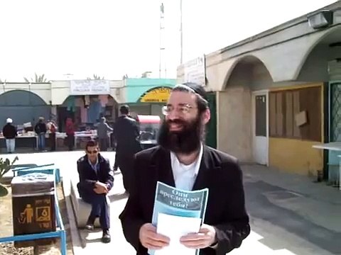 Orthodox Jews harassing Christians outside a Christian shop