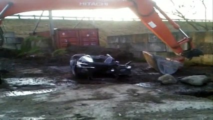 Car origami using a 20 ton  digger.