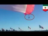 Freak accident: Flag launches soldier into the air, he falls 50 feet and survives - TomoNews