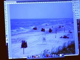 BP covers oil with sand on Gulf Shores Beach as the Coast Guard looks on