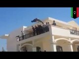 Dawn of Libya militants storm abandoned U.S. Embassy in Tripoli and have a swim