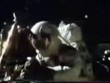 Moon Hoax Apollo 16 : Cable is Seen Moving Above The Astronaut's Backpack in The Fake Moon Bay