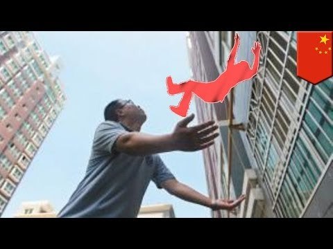 Man catches baby falling from eight-story building window caught on tape