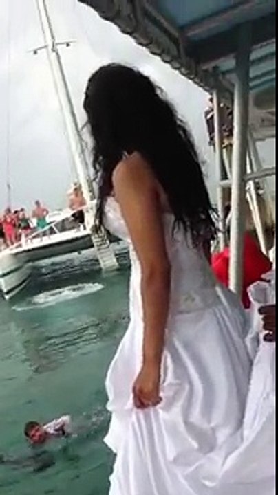 A bride jumping in water almost drowned because of wedding dress! Crazy...