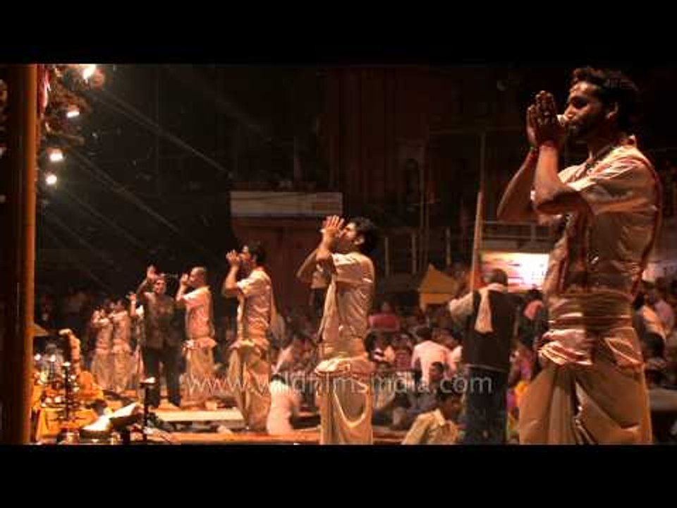 Group of Hindu priests blowing Turbinella pyrum conch during Ganga Aarti puja, Varanasi