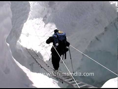 Sherpas cross dangerously crevassed glacier, Everest