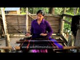 A Lotha Naga woman weaving on loin loom