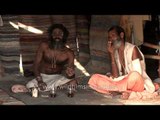 Harmless but dangerous looking Aghori sadhu smokes weed in his hut