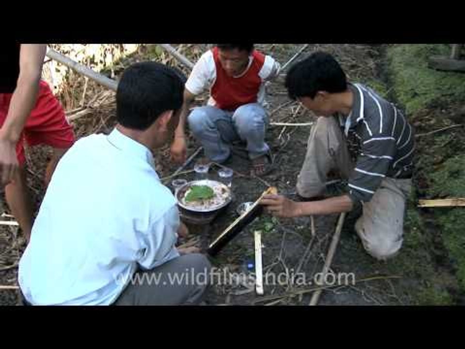 Cooking in hollow bamboo!