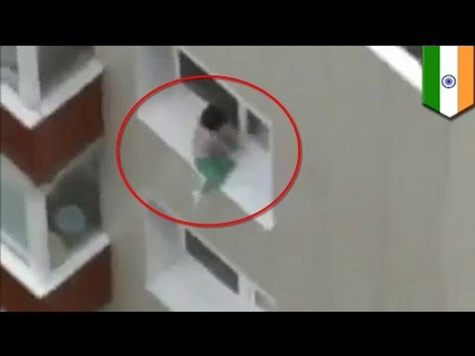 Baby walks along ledge of high rise window in India!