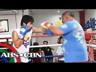 Pacquiao trains early, studies Floyd's style