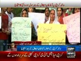 Civil society protests outside Agha Khan Hospital against bus attack