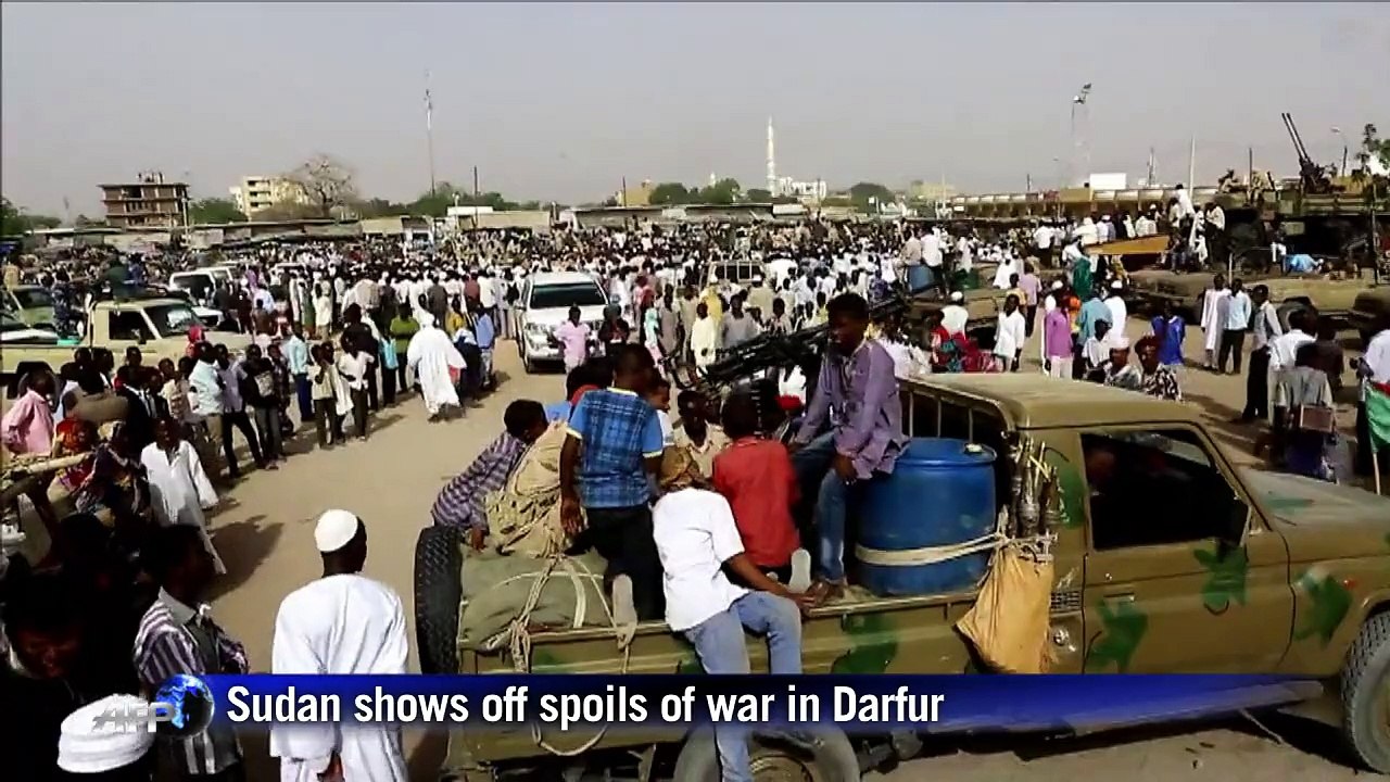 Showing off spoils of war, Sudan claims progress in Darfur