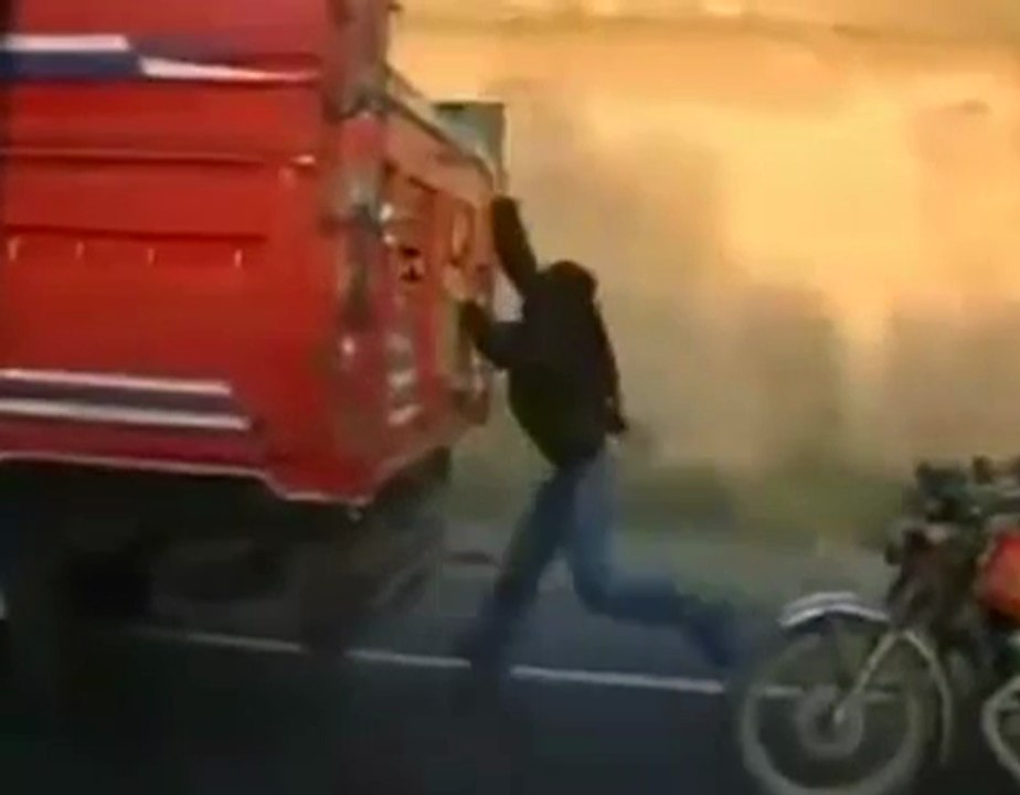 Thief stealing from truck