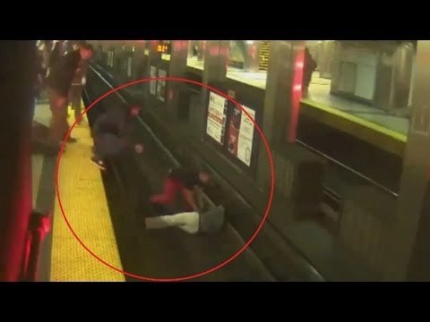 Boston subway rescue: three men leap onto tracks to rescue fallen rider
