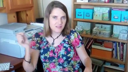 Quadriplegic picking paper off the floor from wheelchair