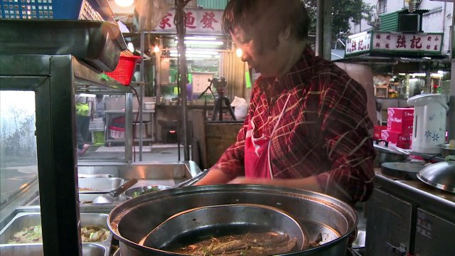 Hong Kong street stalls hang on under the skyscrapers