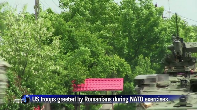 US troops greet Romanian locals during NATO exercises