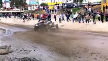 class 1 buggies through riverbed at baja 1000 with spin out