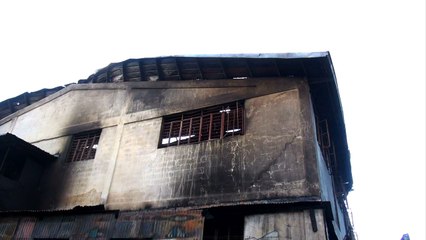 Philippine factory fire kills 72, barred windows blamed