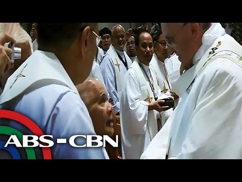 Ill, retired priest gets hug from Pope Francis