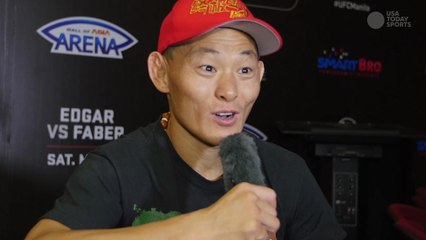 Ning Guangyou celebrates a big win at UFC Fight Night 66