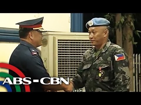 Peacekeepers honored after 3-week quarantine