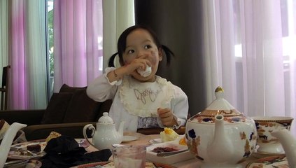 Girl Having Afternoon Tea