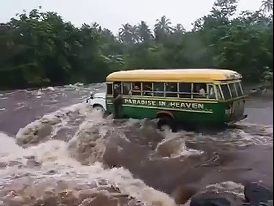 Crowded bus falls into river