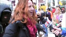 Masked Occupy Protester Disrupts TV Interview