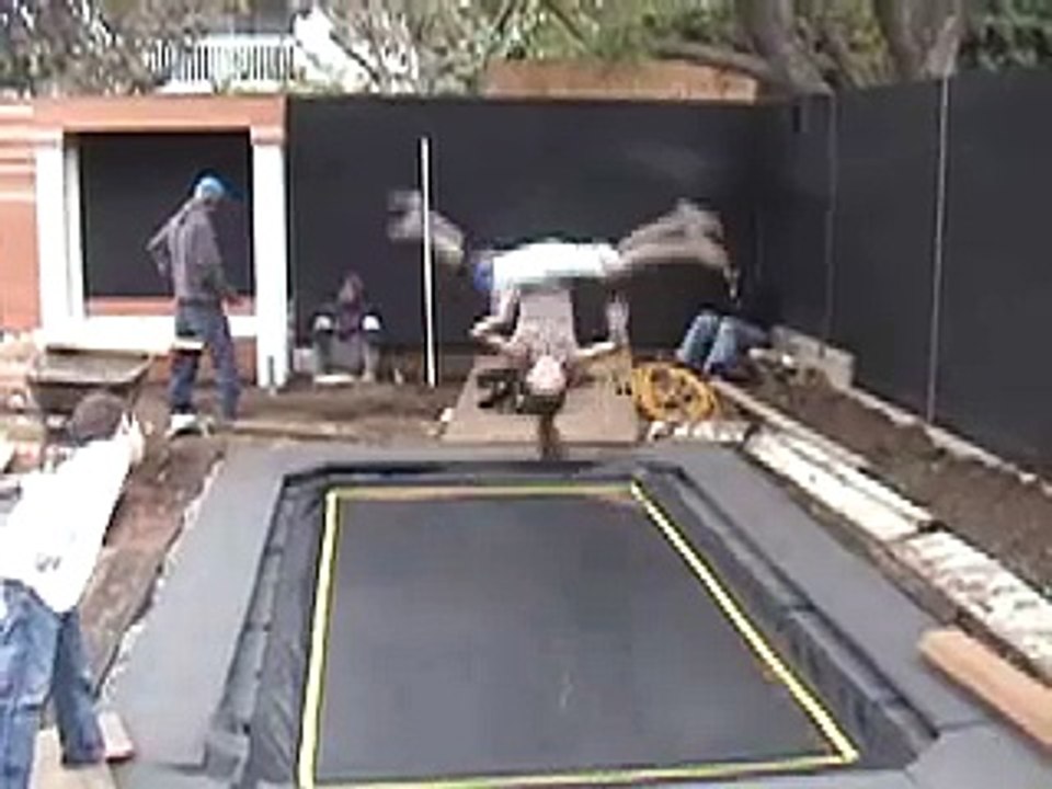 Kids doing Gymnastics Tricks on a Trampoline