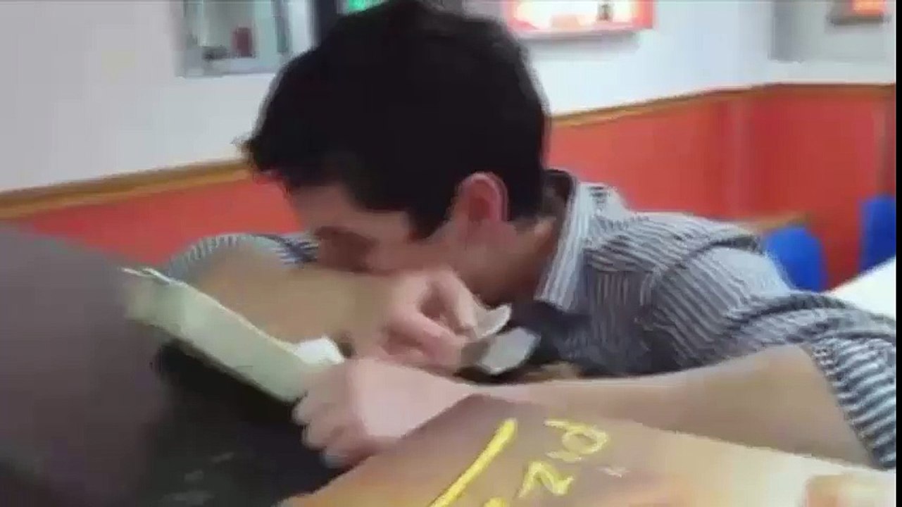 The drunk guy eats a box
