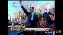 Protester attacks Assads´s car Scuffles erupt around Syrian President Bashar al-Assad's car