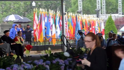 Emma Sulkowicz, CC '15, walks across Columbia College Class Day stage with mattress