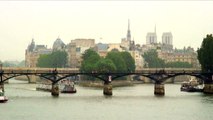 Royalty Free Stock Footage of Ferries going under bridges on the Seine in Paris, France.