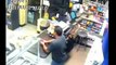 Unedited: Masked gunman confronts Machete wielding store owner (shots fired)