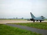 pair of eurofighters taking off at coningsby