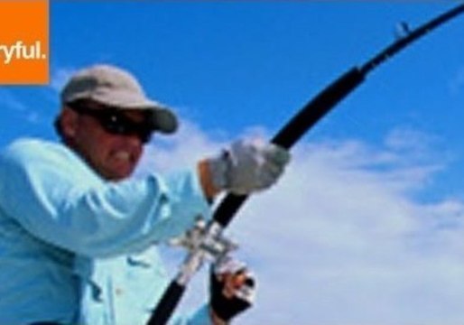 Strong Fisherman Runs on Beach to Reel in Shark